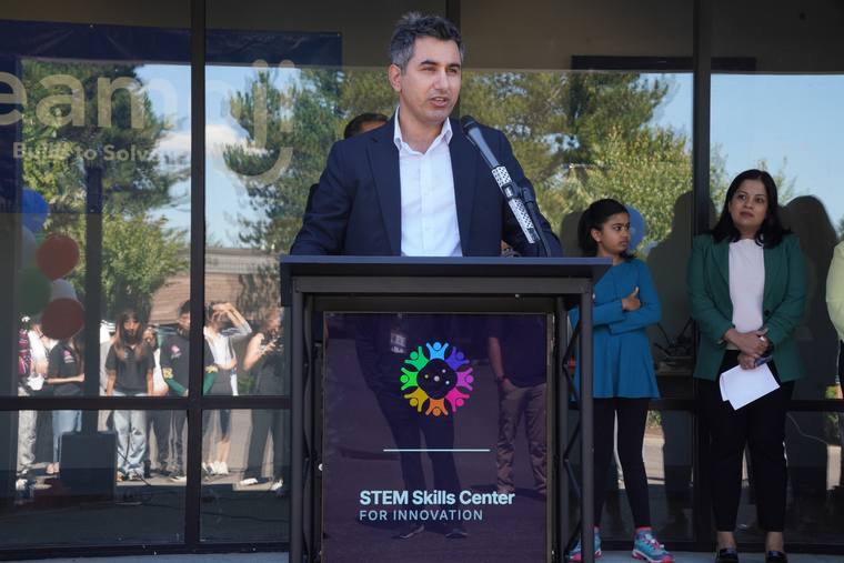 Opening remarks from the podium outside the center