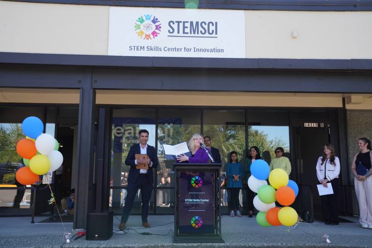 The new STEMSCI storefront on opening day, podium and balloons ready