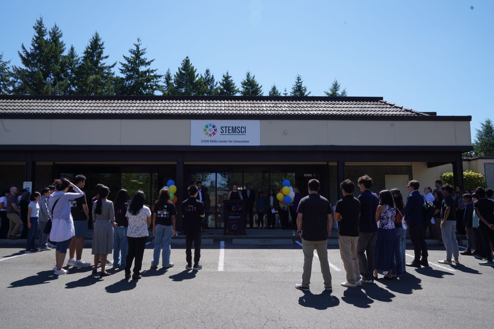 Guests gathering outside the STEM Skills Center before the ceremony